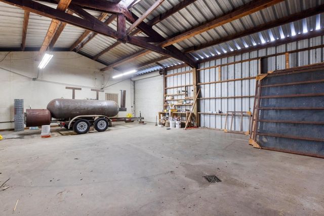 a view of a kitchen with utility room and windows