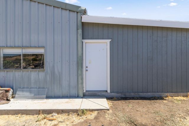 a bathroom with a tub and shower