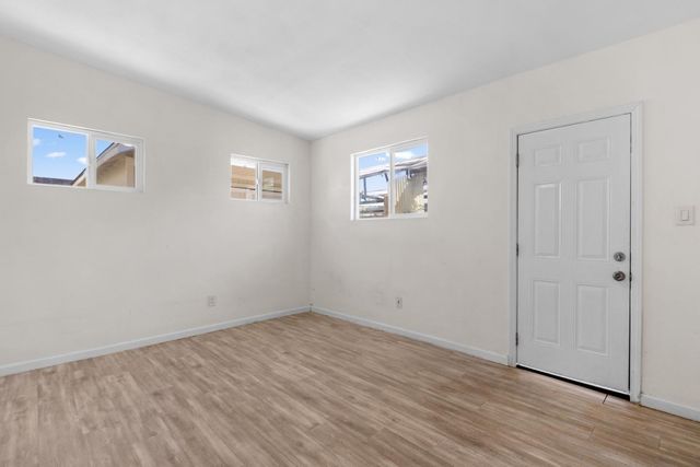 a bathroom with a sink mirror and toilet