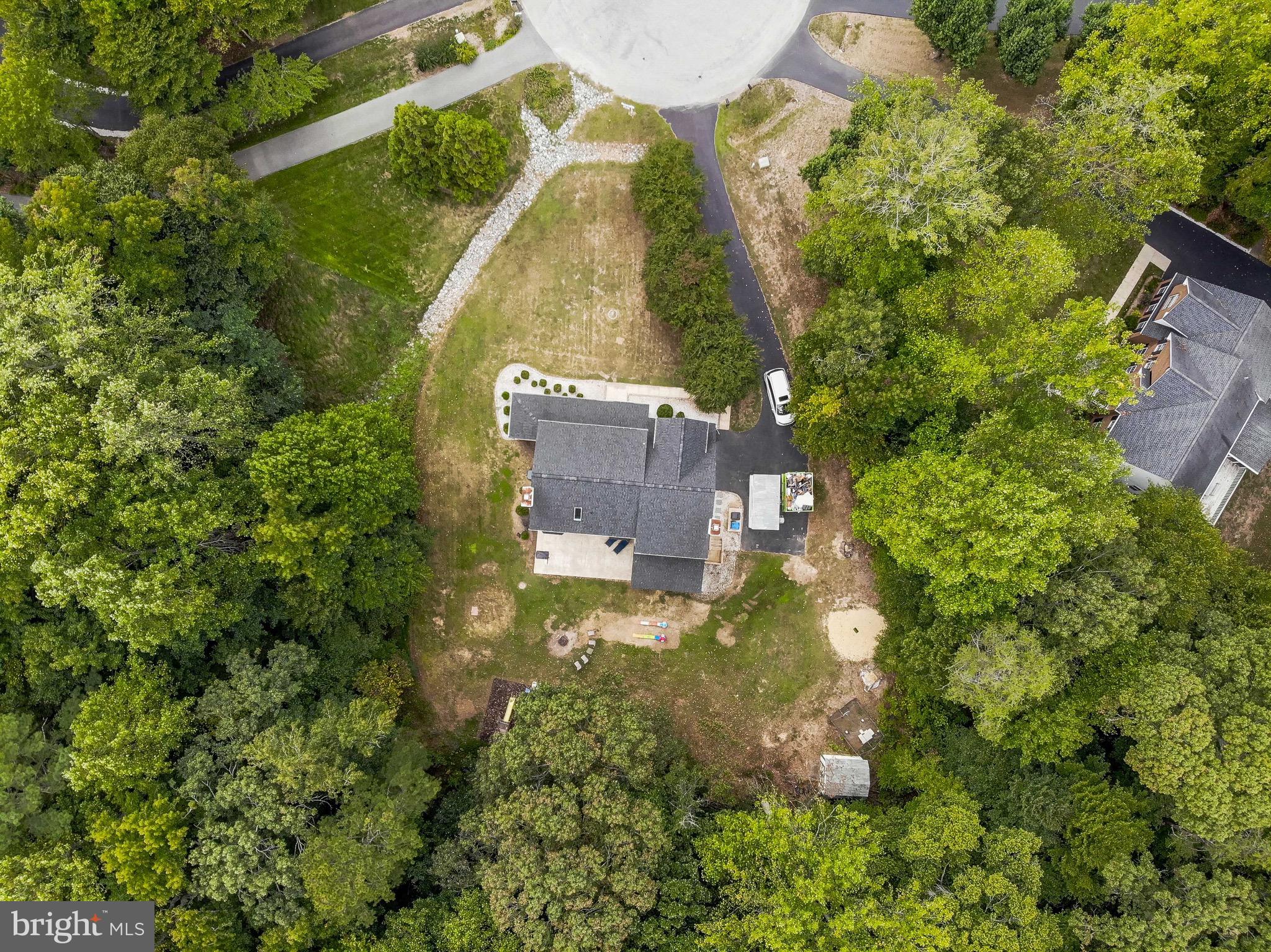 721 Small Reward Road Huntingtown, MD 20639 - Photo 39 of 51 an aerial view of a house with a yard