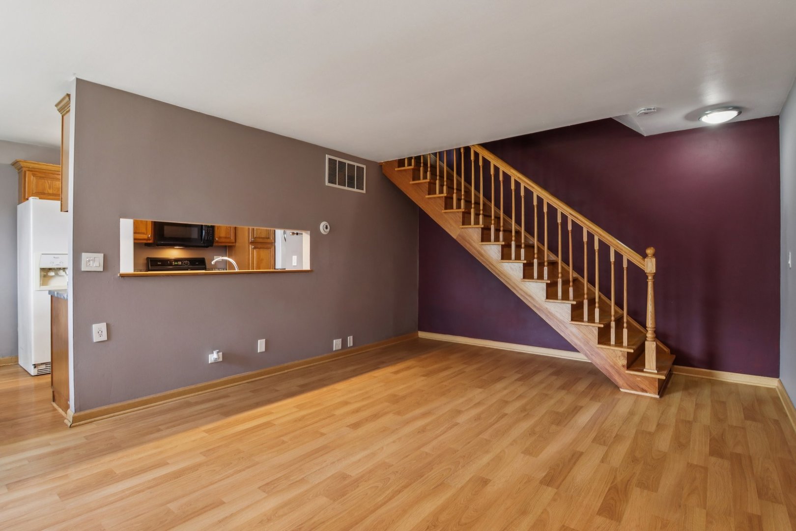 225 Foxhead Court, Unit B Bolingbrook, IL 60440 - Photo 3 of 14 a view of an empty room with stairs and stairs