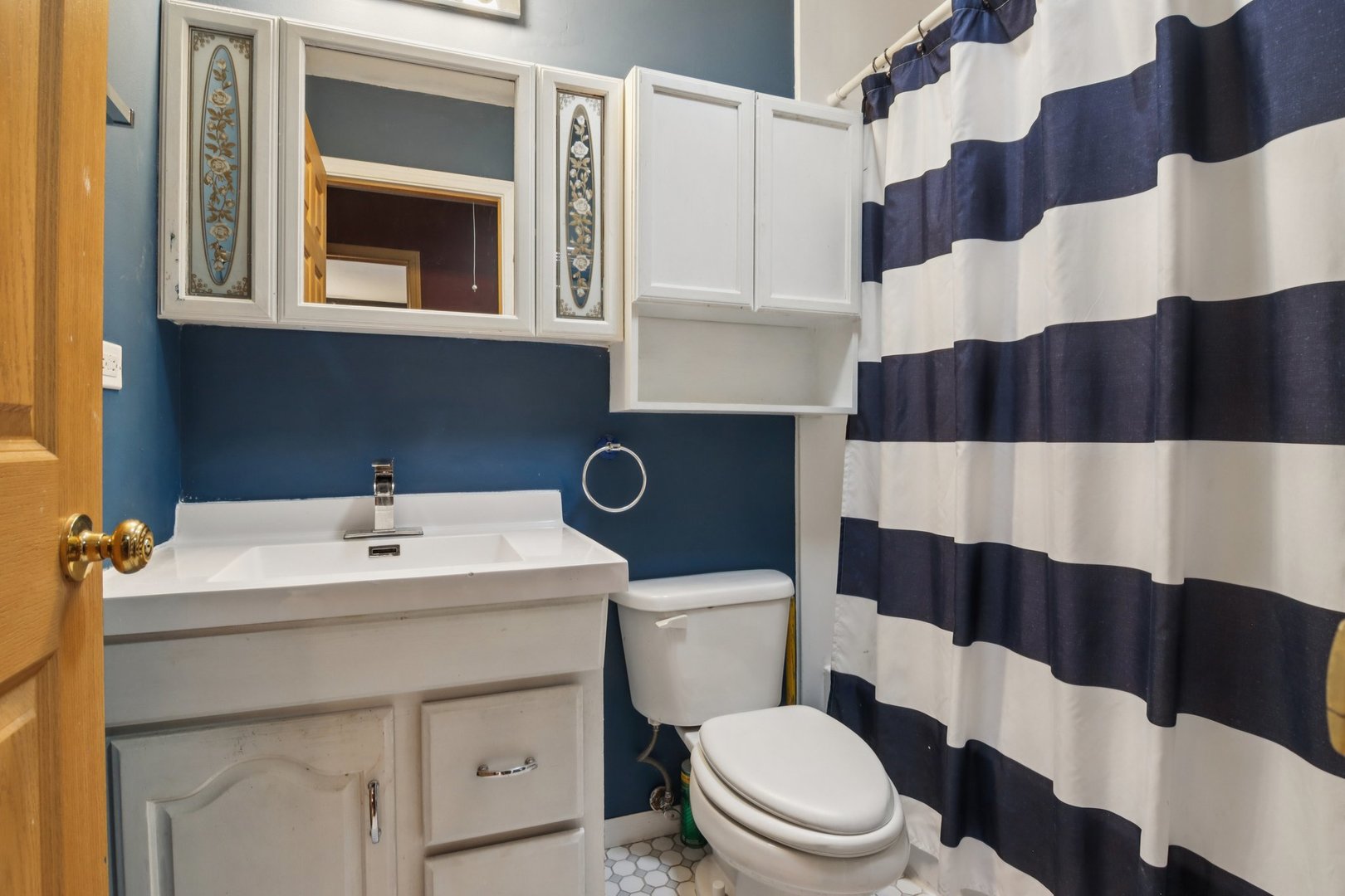 225 Foxhead Court, Unit B Bolingbrook, IL 60440 - Photo 8 of 14 a bathroom with a sink a toilet and a mirror
