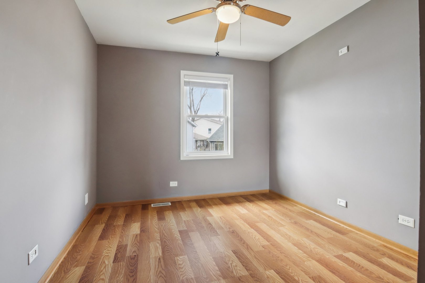 225 Foxhead Court, Unit B Bolingbrook, IL 60440 - Photo 9 of 14 a view of empty room with wooden floor and fan