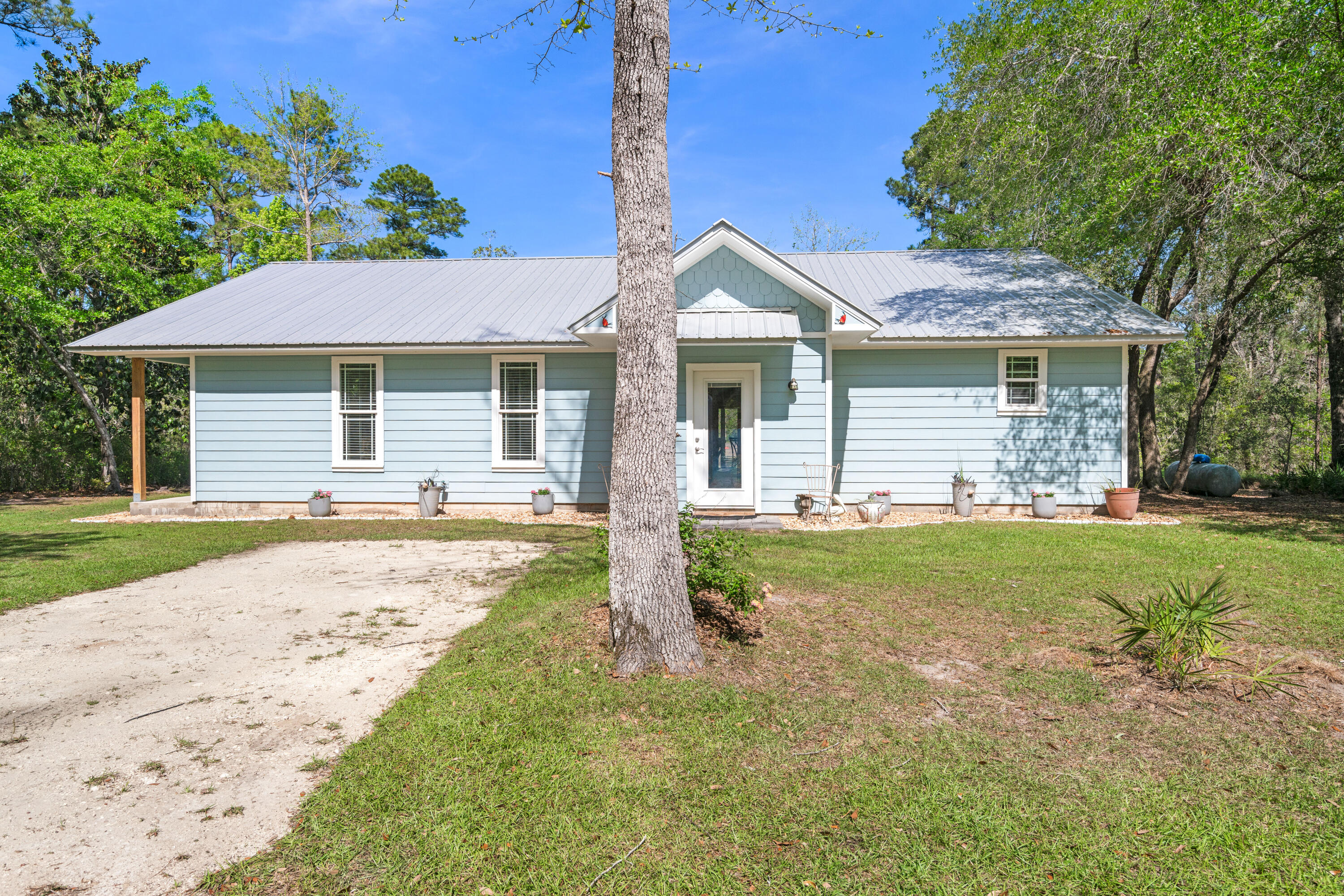 528 Bay Grove Road Freeport, FL 32439 - Photo 3 of 68 a front view of a house with a yard