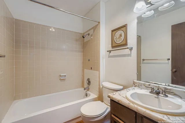 a view of backyard with tub and wooden fence