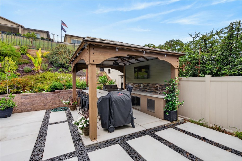 11137 Briar Rose Court Corona, CA 92883 - Photo 32 of 45 built in bbq area with sink and refrigerator