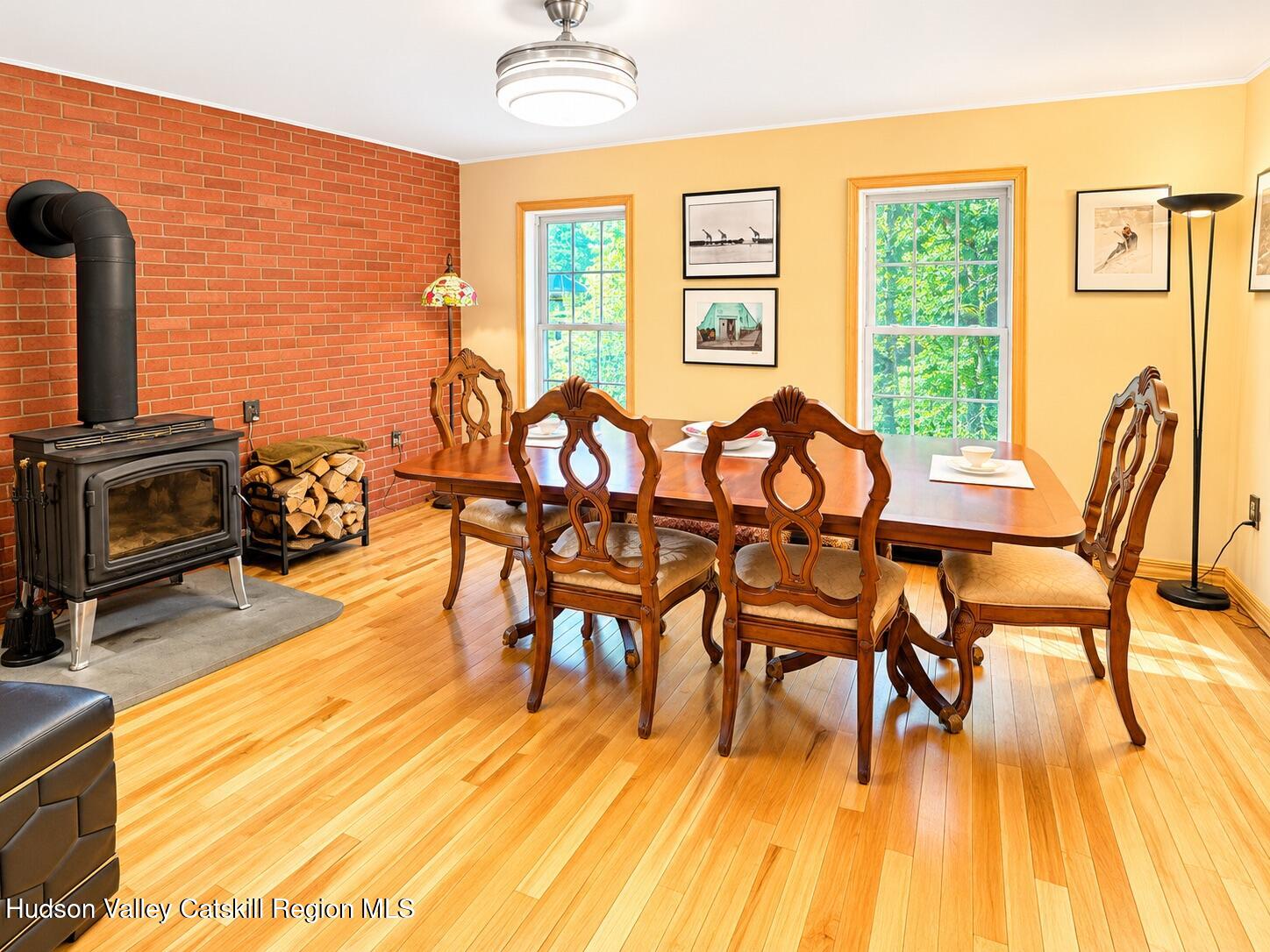 14 Park Road Chichester, NY 12416 - Photo 4 of 20 a view of a dining room with furniture a chandelier and wooden floor