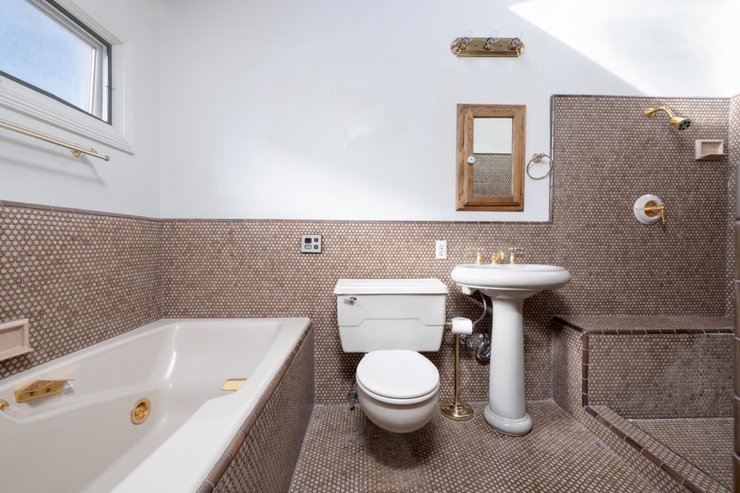 321 Ashton Avenue Millbrae, CA 94030 - Photo 11 of 18 a bathroom with a sink a toilet and bathtub