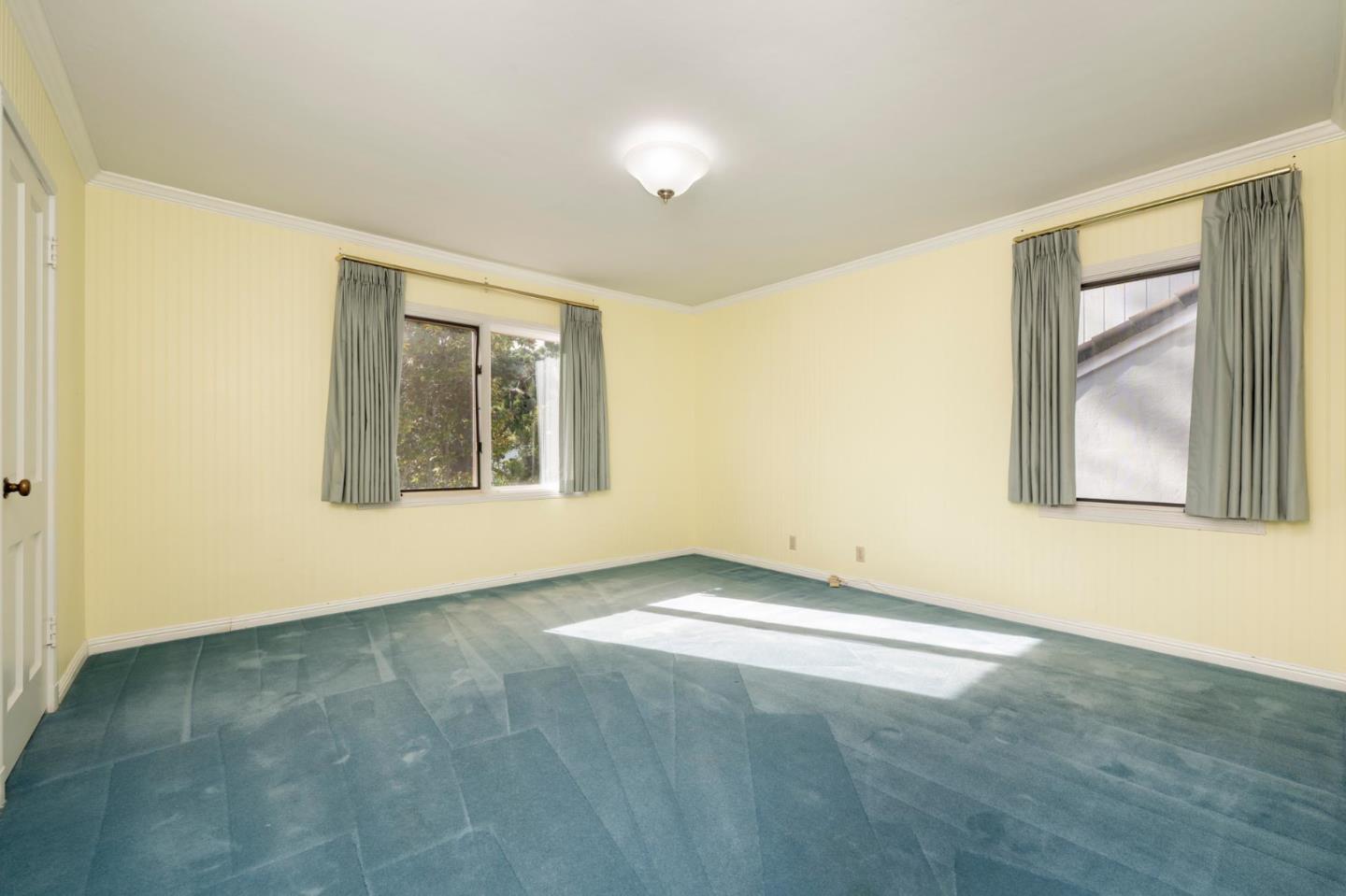 321 Ashton Avenue Millbrae, CA 94030 - Photo 13 of 18 an empty room with windows and closet