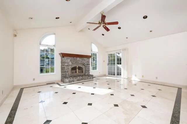 a view of a living room with a large window