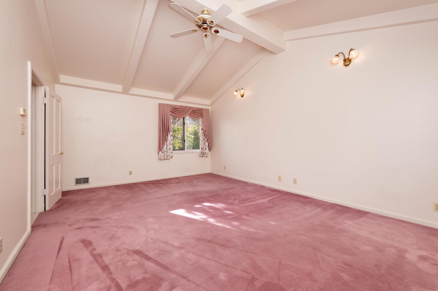 321 Ashton Avenue Millbrae, CA 94030 - Photo 10 of 18 an empty room with windows and ceiling fan view