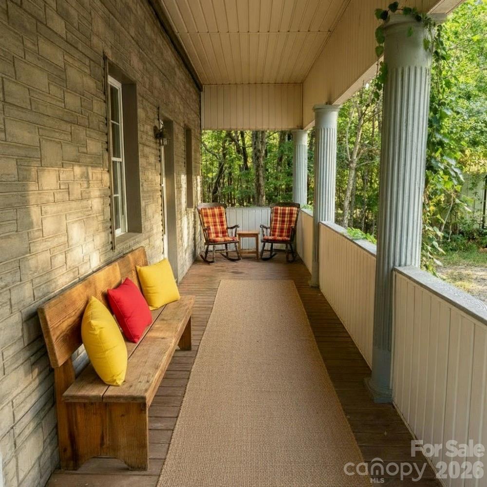2051 Sutton Spring Road York, SC 29745 - Photo 15 of 47 a balcony with couch and large windows