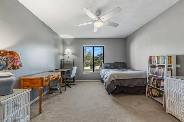 a bed room with a bed and a window