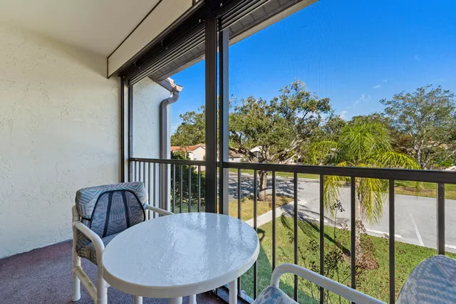 a view of a balcony with furniture