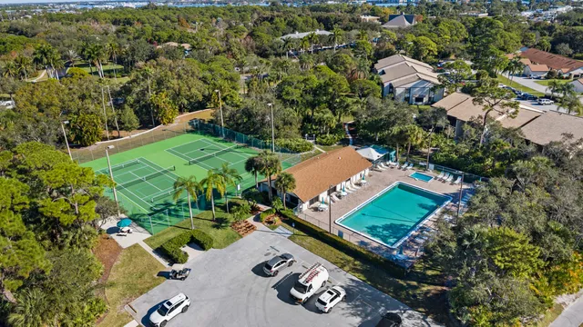 an aerial view of a houses with a yard
