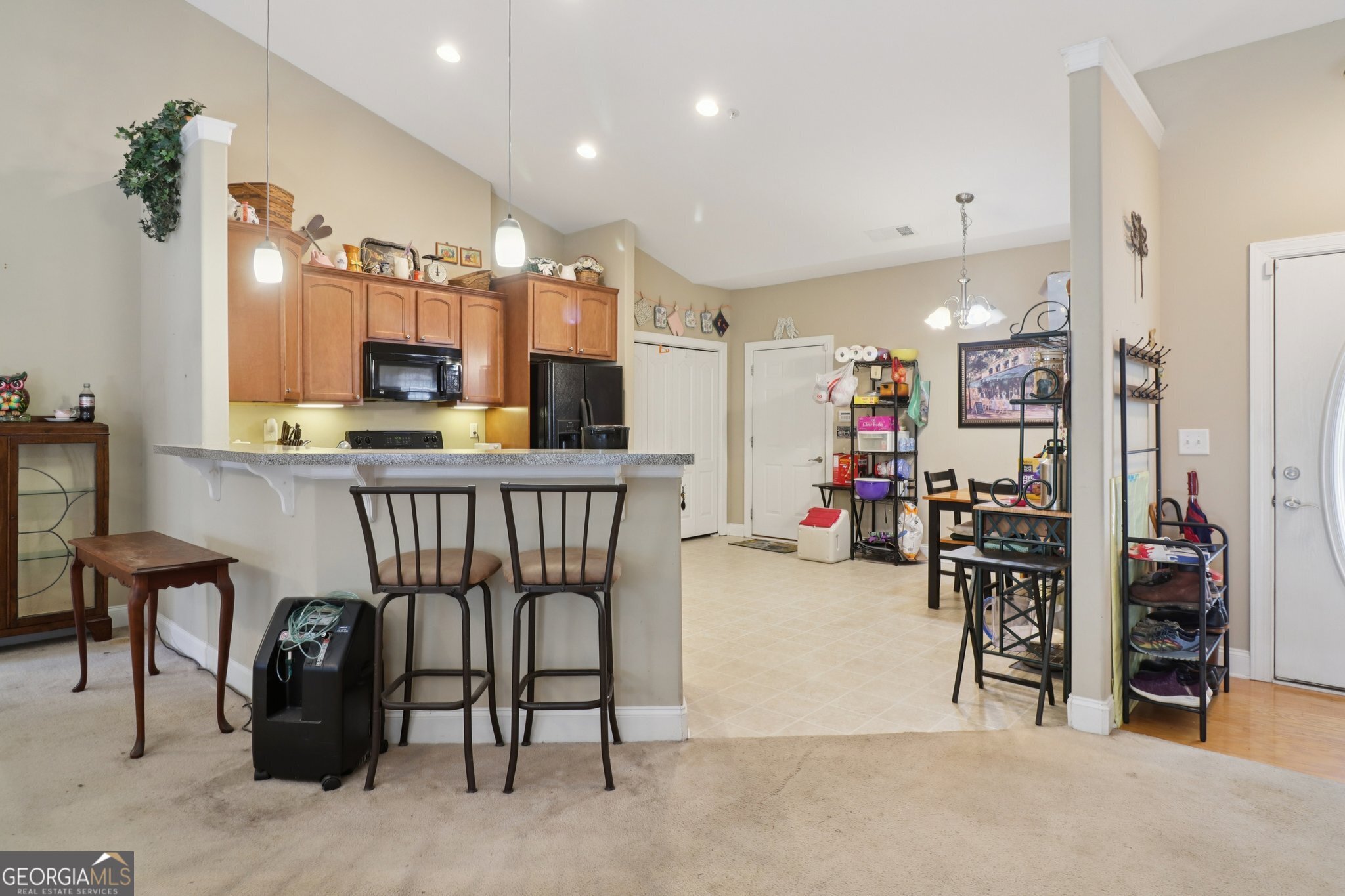 1502 Commonwealth Circle Newnan, GA 30263 - Photo 10 of 30 a view of a hallway with kitchen and dining area
