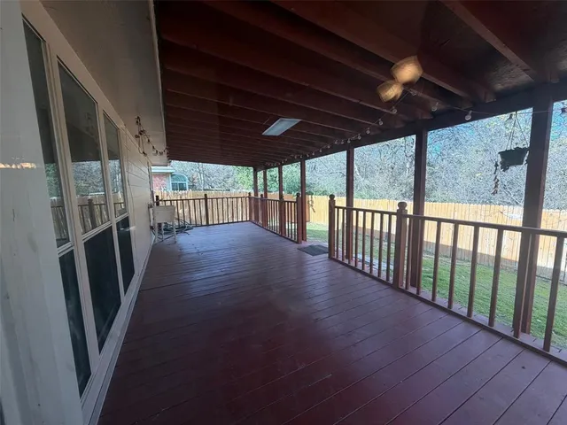 a view of a porch with wooden floor