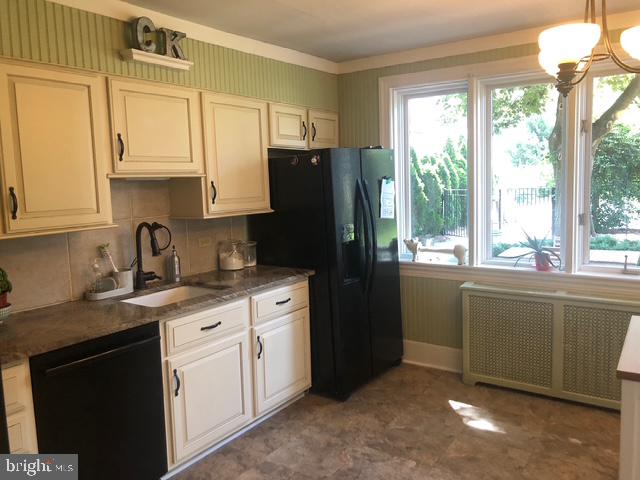 12 Windsor Circle Springfield, PA 19064 - Photo 15 of 28 a kitchen with stainless steel appliances granite countertop a refrigerator and a sink