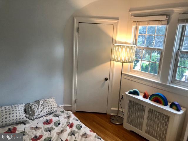 12 Windsor Circle Springfield, PA 19064 - Photo 22 of 28 a bedroom with a bed and wooden floor