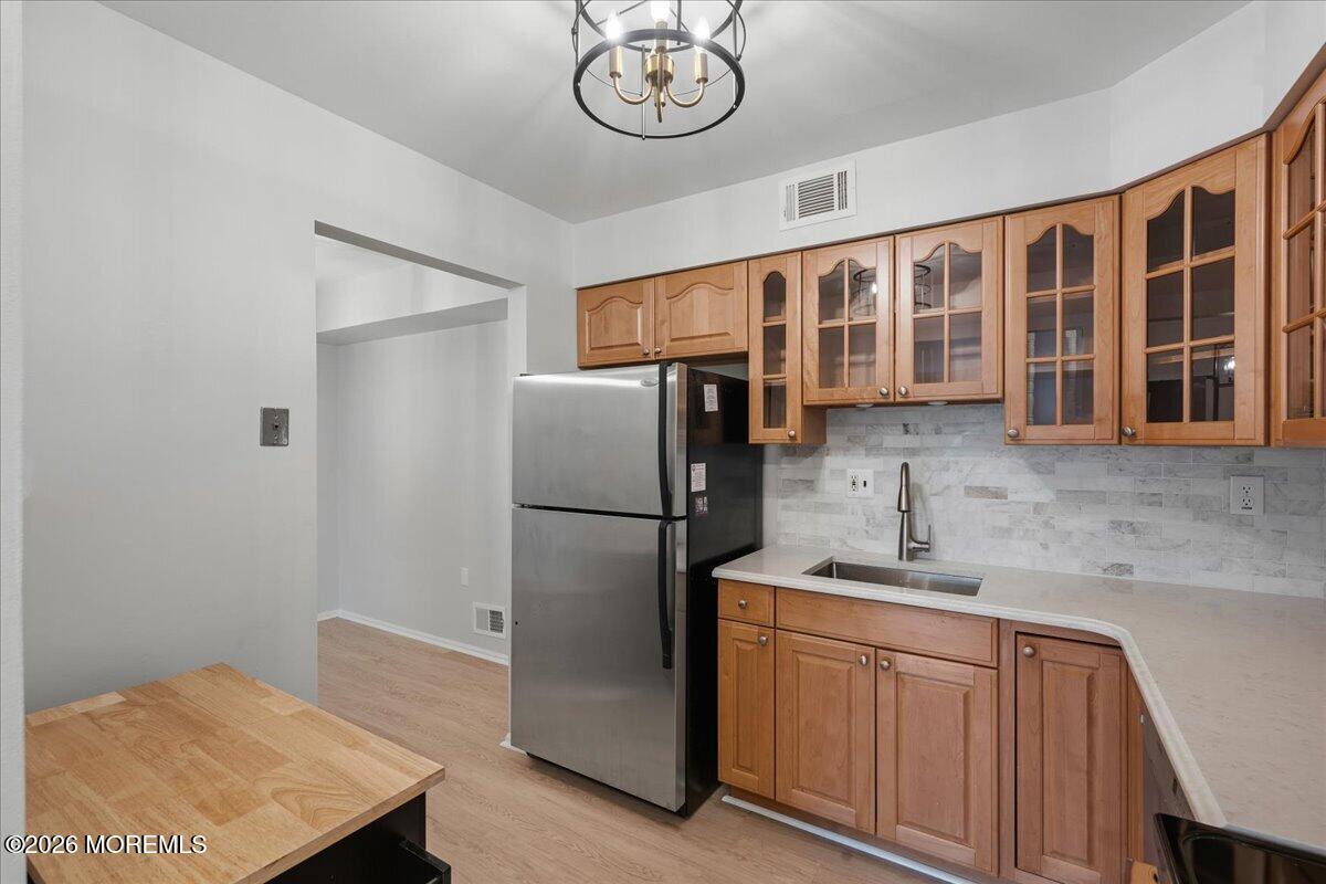 405 Wellington Place Matawan, NJ 07747 - Photo 12 of 29 a kitchen with stainless steel appliances granite countertop a refrigerator and a sink