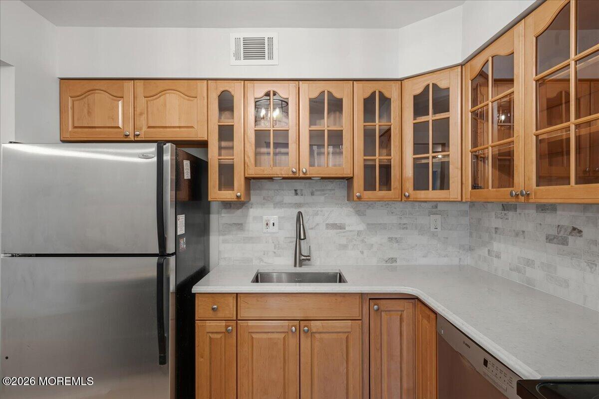 405 Wellington Place Matawan, NJ 07747 - Photo 13 of 29 a kitchen with a refrigerator and a sink