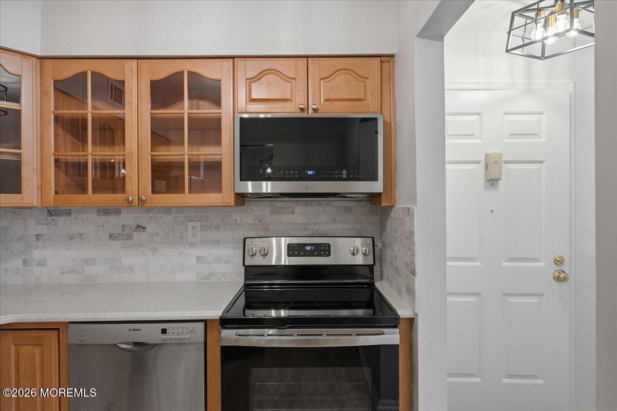 405 Wellington Place Matawan, NJ 07747 - Photo 14 of 29 a kitchen with granite countertop a stove and a microwave