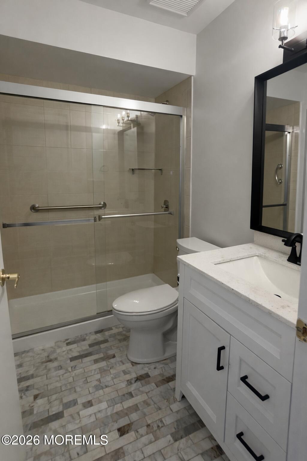 405 Wellington Place Matawan, NJ 07747 - Photo 17 of 29 a bathroom with a granite countertop toilet a sink and shower