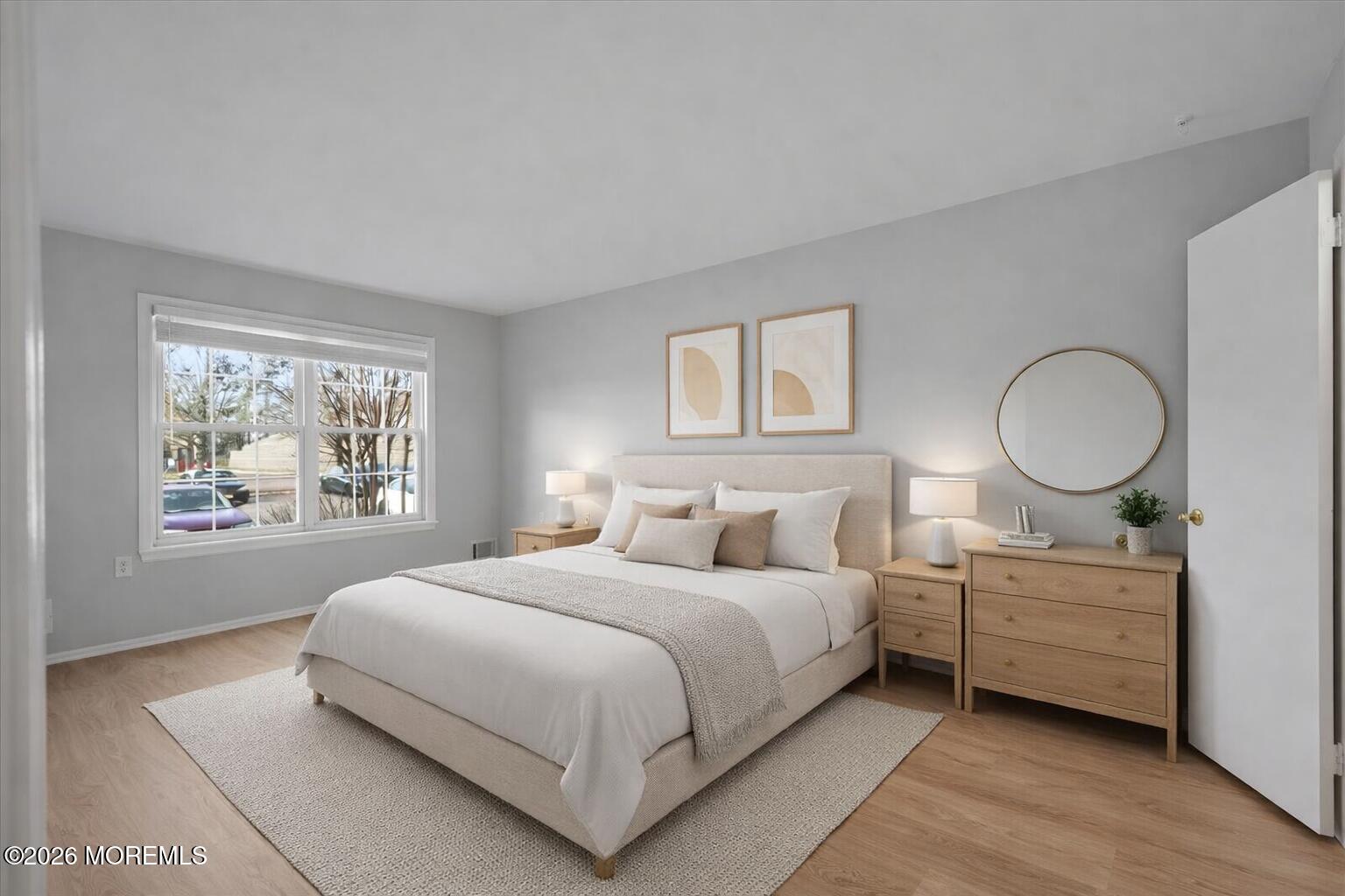 405 Wellington Place Matawan, NJ 07747 - Photo 20 of 29 a bedroom with a large bed and a window