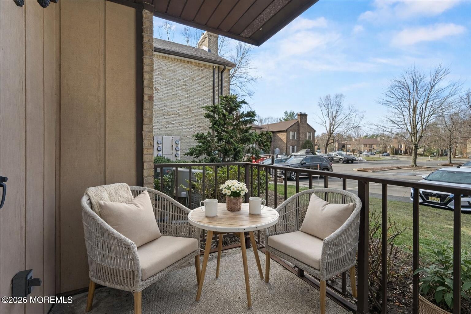 405 Wellington Place Matawan, NJ 07747 - Photo 26 of 29 a balcony with table and chairs