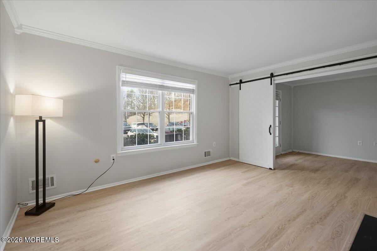 405 Wellington Place Matawan, NJ 07747 - Photo 4 of 29 an empty room with windows and closet