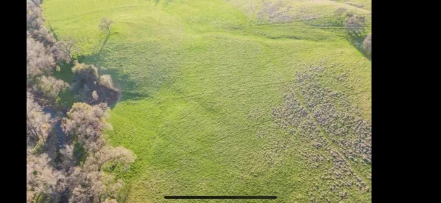 a view of an ocean from a mountain