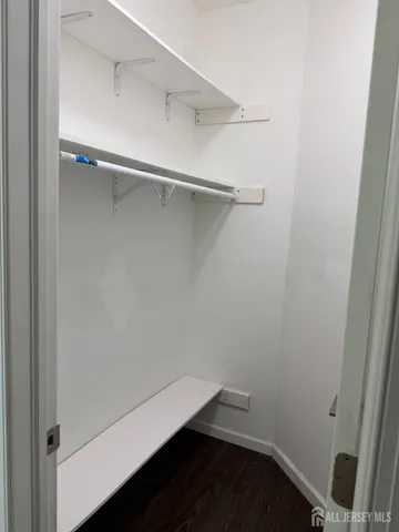 a bathroom with a sink a mirror and a light fixture