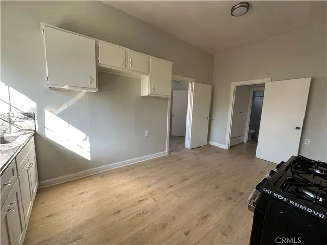 a kitchen with a sink and a stove