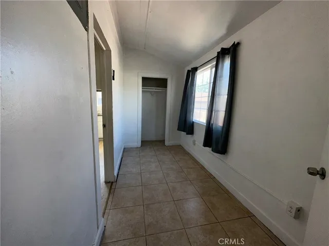 a view of a hallway with windows
