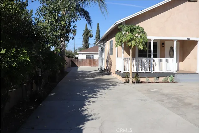 a view of house with outdoor space and porch