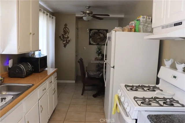 a bedroom with a bed and a chair