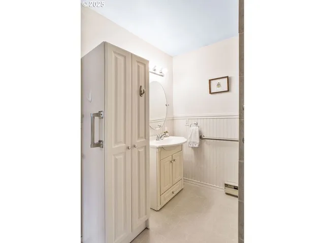 a bathroom with a sink and mirror