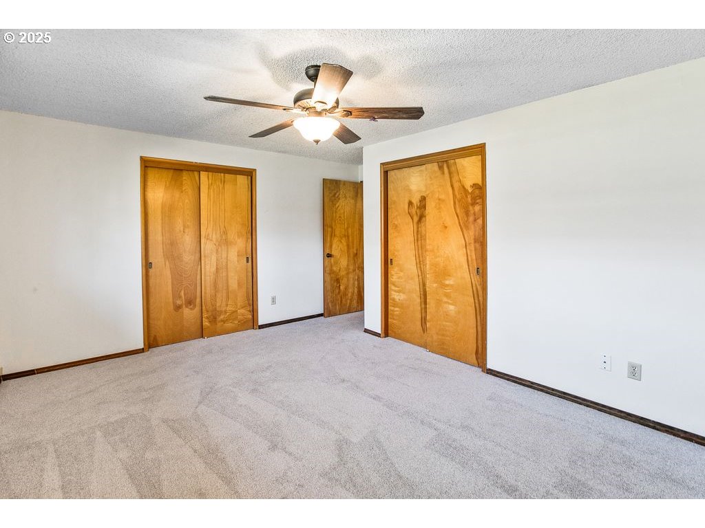 569 Northeast Fleming Avenue Gresham, OR 97030 - Photo 15 of 32 a view of an empty room with chandelier fan and a window