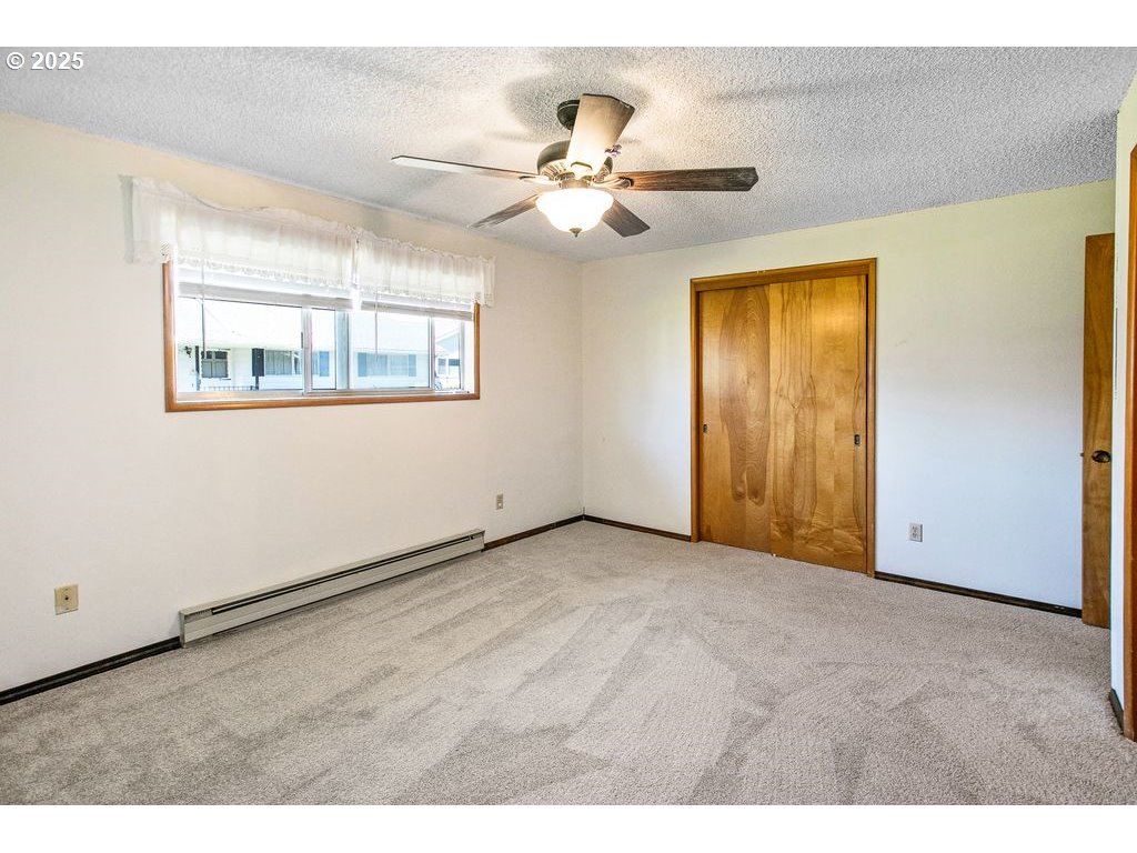 569 Northeast Fleming Avenue Gresham, OR 97030 - Photo 16 of 32 a view of an empty room with a window