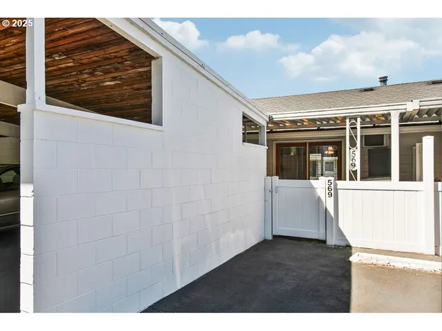 a view of house with backyard