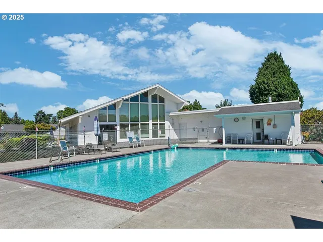 a front view of a house with a swimming pool