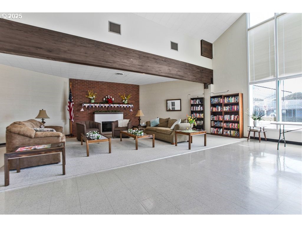 569 Northeast Fleming Avenue Gresham, OR 97030 - Photo 30 of 32 a living room with furniture and a book shelf