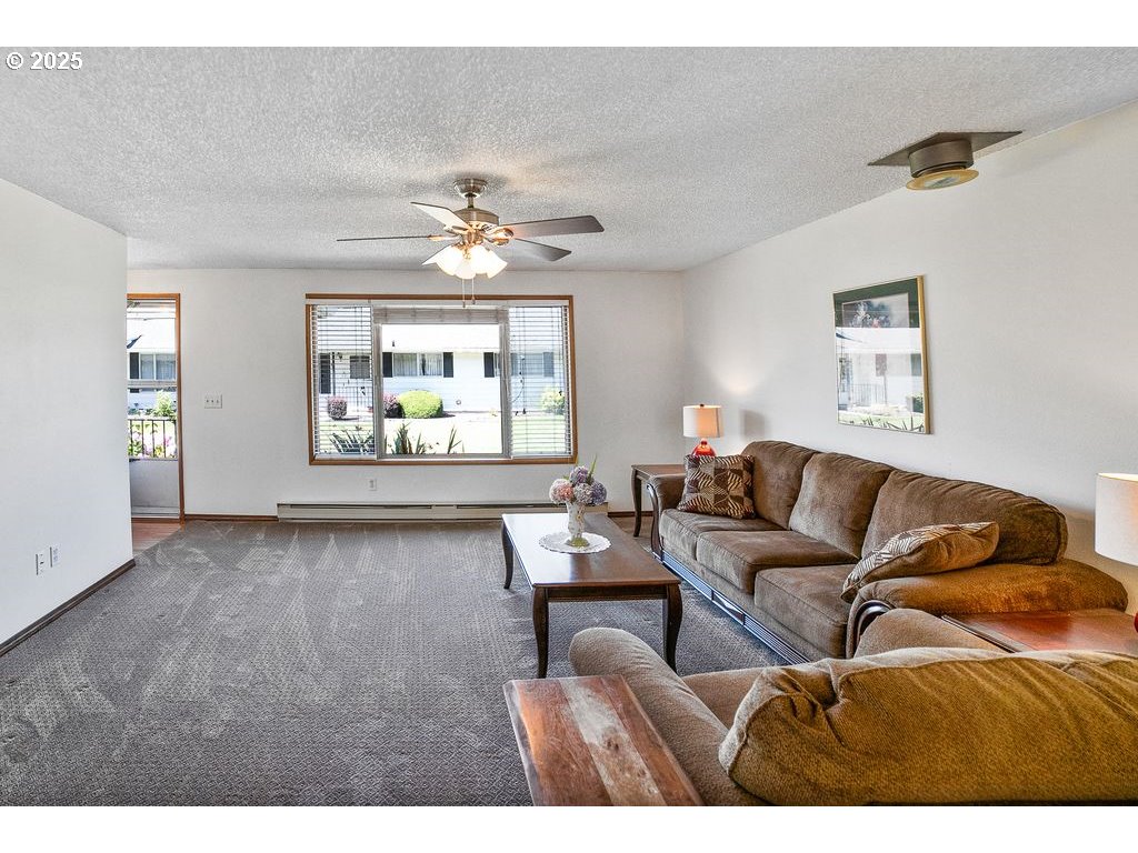 569 Northeast Fleming Avenue Gresham, OR 97030 - Photo 5 of 32 a living room with furniture and a window