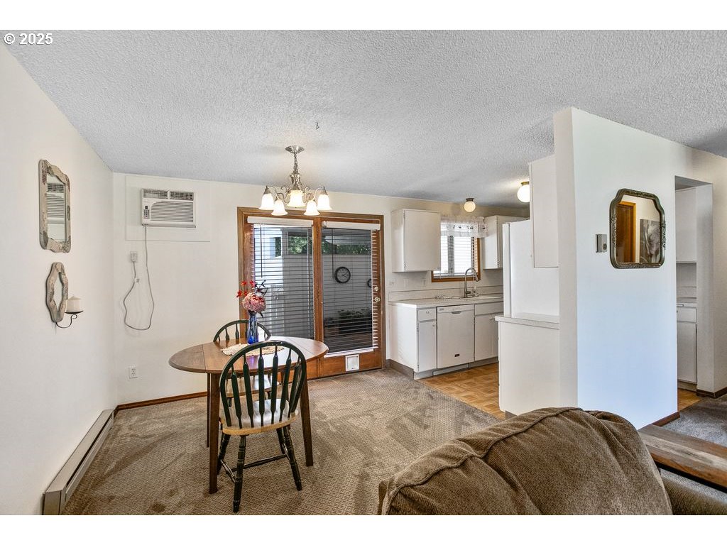 569 Northeast Fleming Avenue Gresham, OR 97030 - Photo 6 of 32 a living room with furniture and chandelier