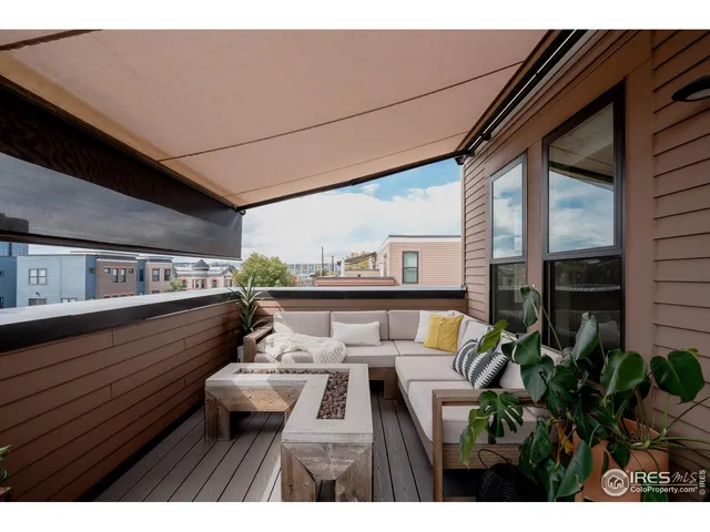 a view of balcony with furniture