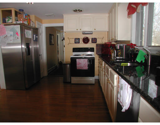 49 Madison Road Wellesley, MA 02481 - Photo 7 of 18 a kitchen with stainless steel appliances granite countertop a refrigerator a stove and a sink