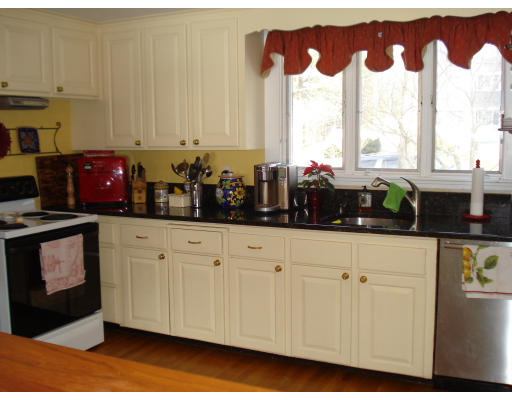 49 Madison Road Wellesley, MA 02481 - Photo 9 of 18 a kitchen with stainless steel appliances white cabinets and a window