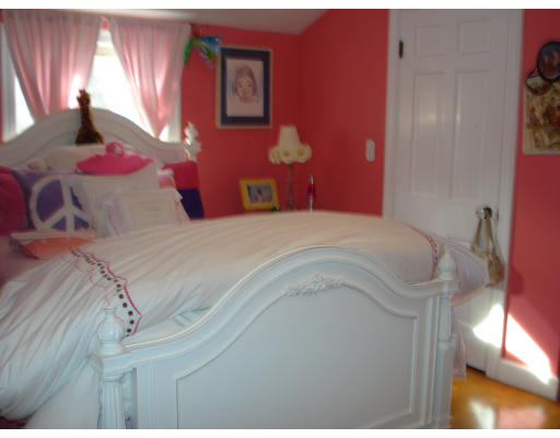 49 Madison Road Wellesley, MA 02481 - Photo 10 of 18 a bedroom with a bed and a chandelier
