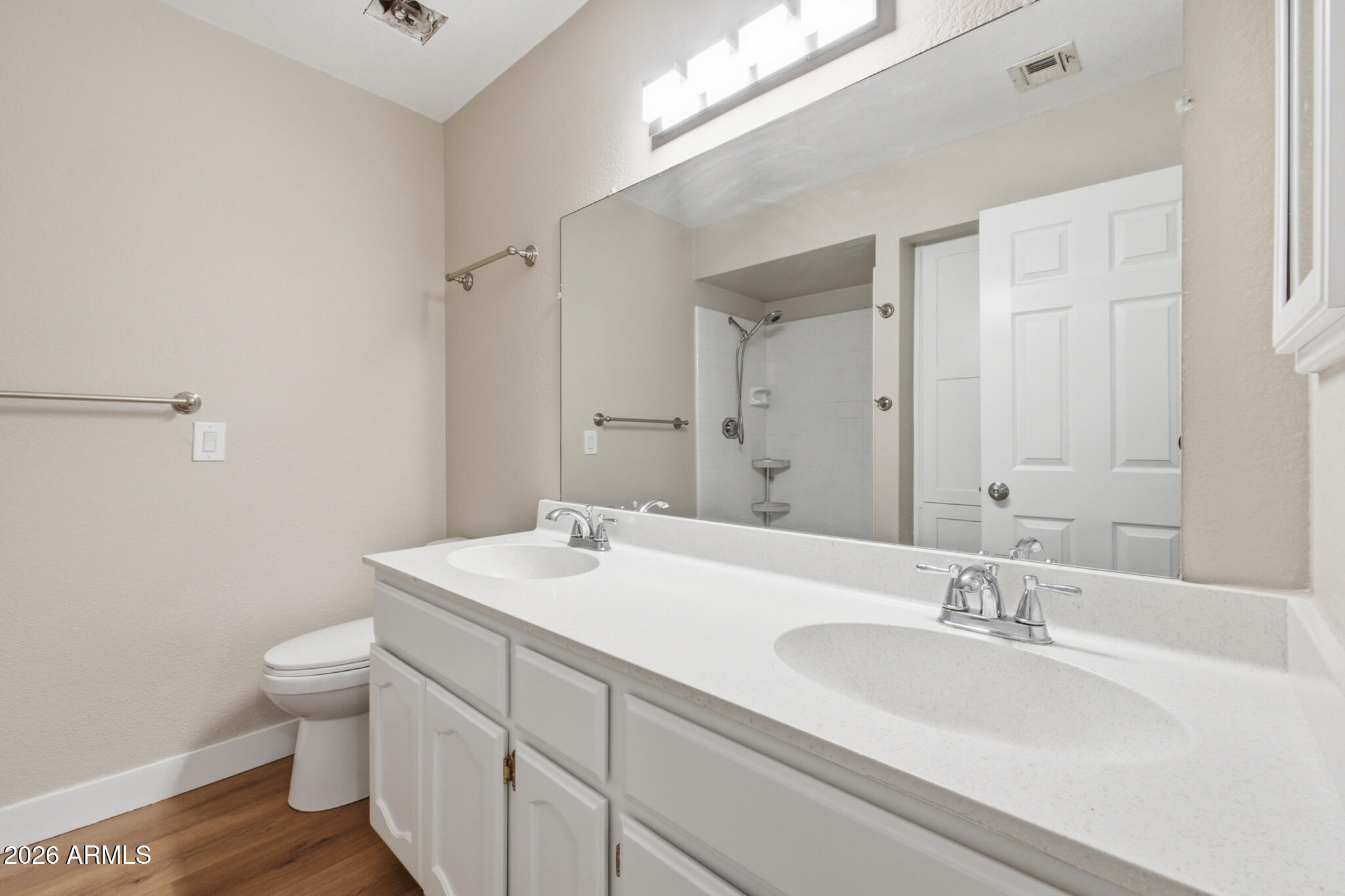 170 East Guadalupe Road, Unit 112 Gilbert, AZ 85234 - Photo 11 of 22 a bathroom with a sink a toilet and a mirror