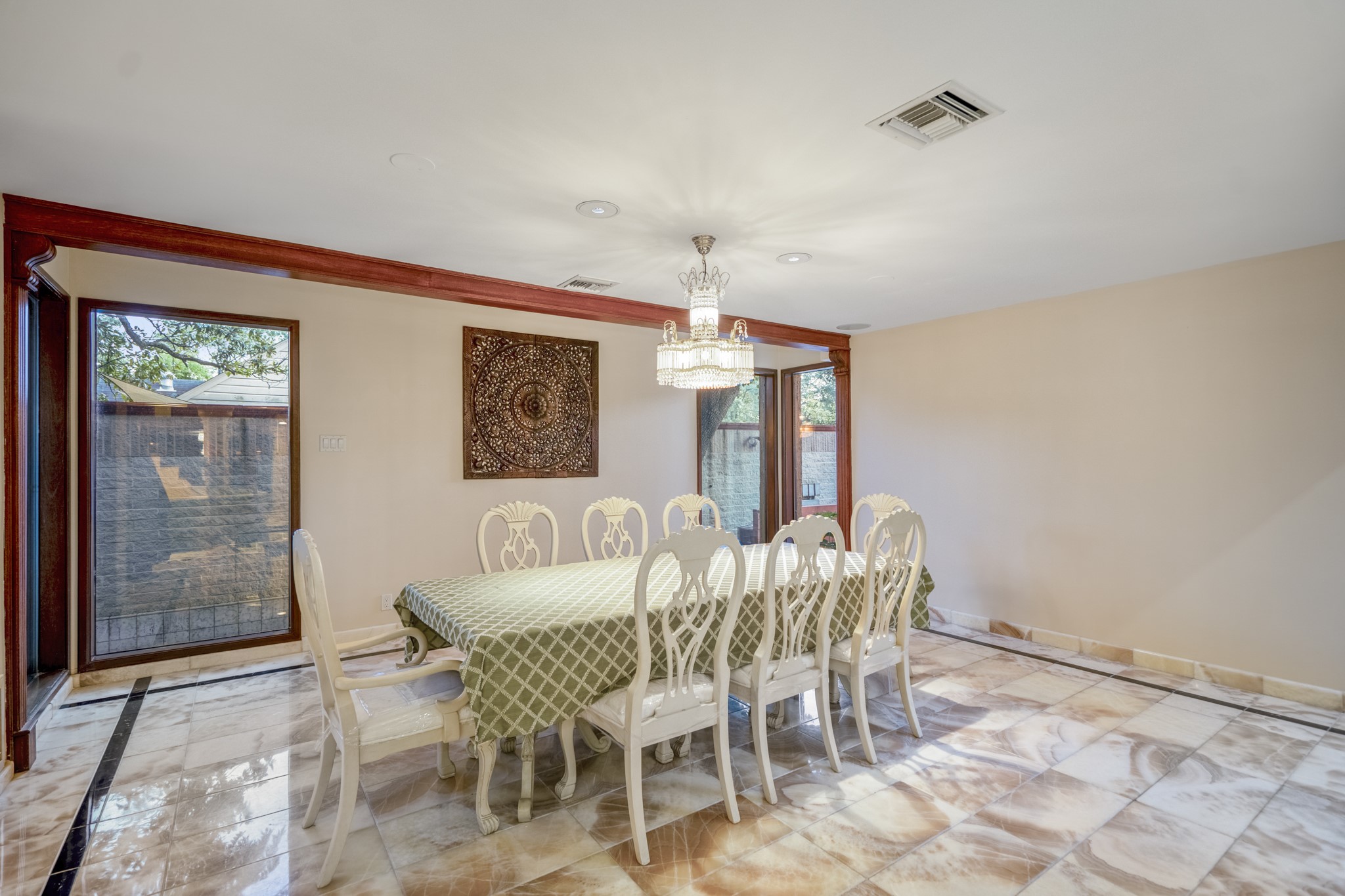 6535 Buffalo Speedway Houston, TX 77005 - Photo 14 of 34 Just off the kitchen, the separate dining area provides a cozy nook for morning coffee, casual meals, and conversation or the ideal setting for hosting a dinner party in a beautifully finished setting.